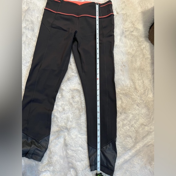 Lululemon capris. Like new. Barely worn. Size 6. Dark grey with coral. - Picture 9 of 10